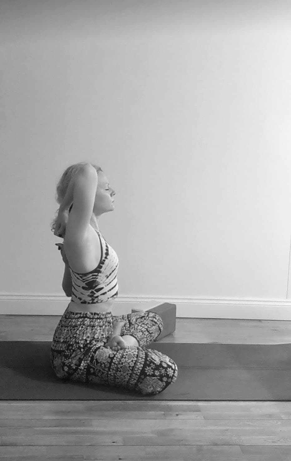 Rachael in a seated yoga pose